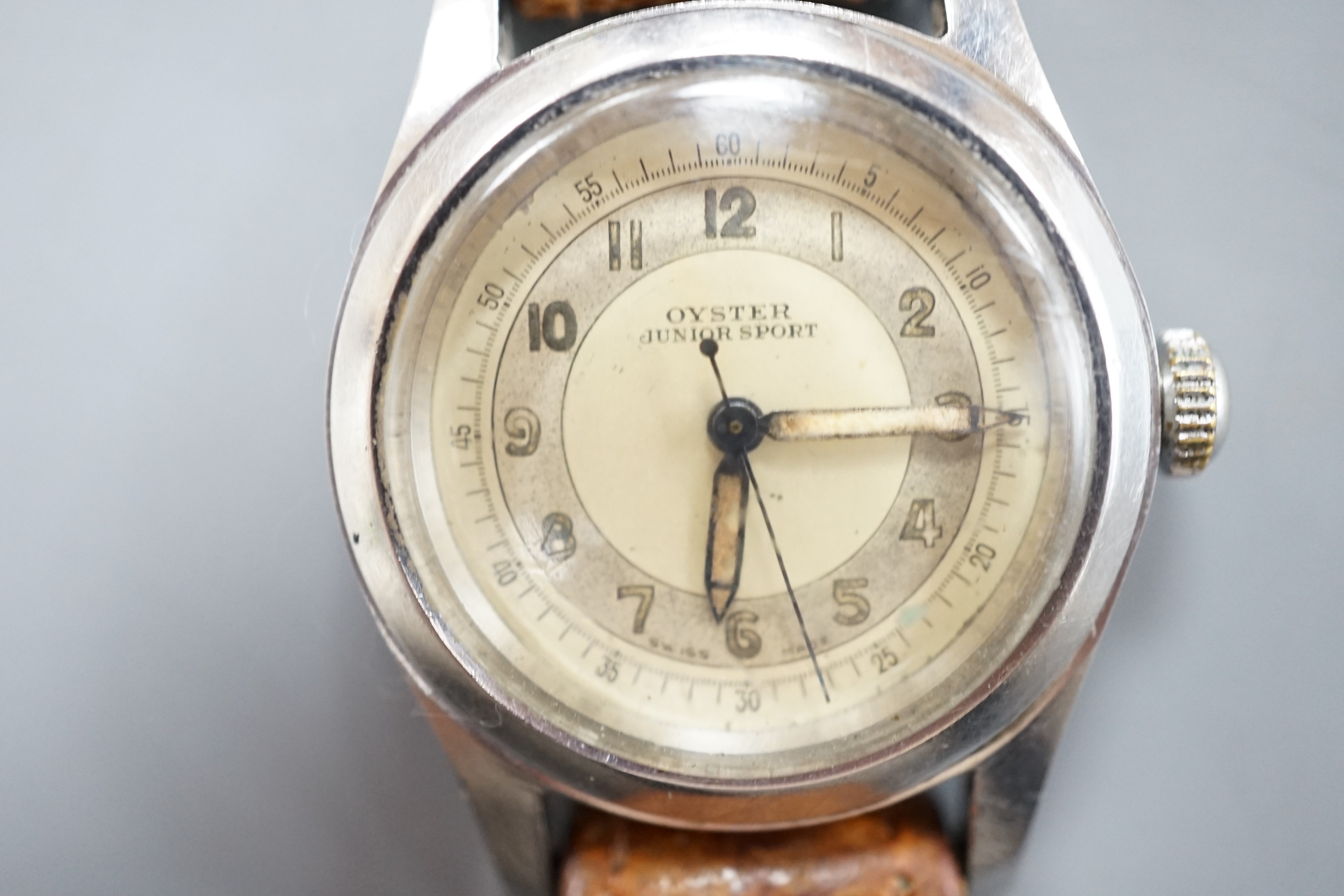 A stainless steel Tudor Oyster Junior Sport manual wind wrist watch, with Arabic dial, on associated leather strap, case diameter 32mm, case back numbered 178194.